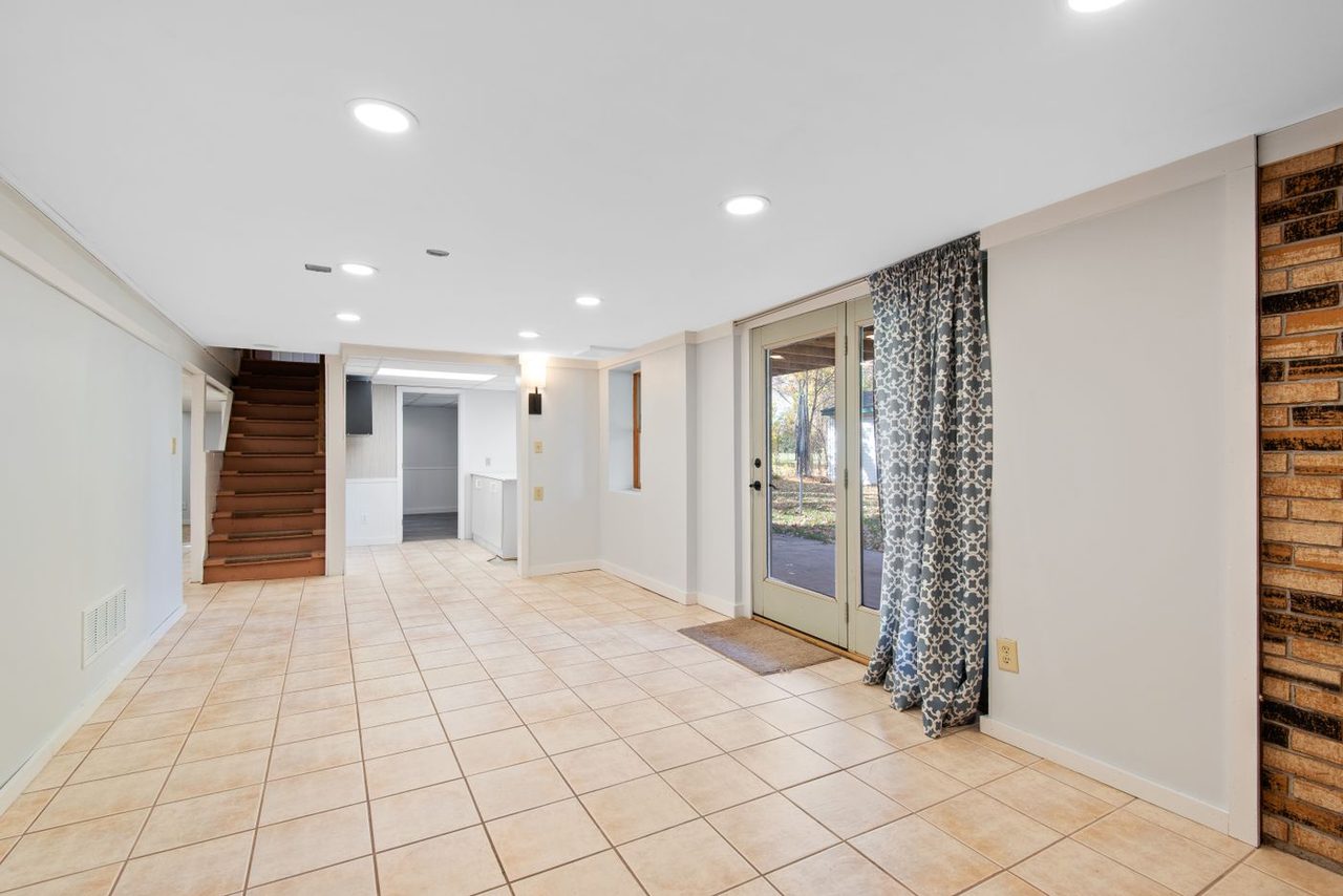 Bright finished basement in Urbana, IL with a clean, seamless coated floor