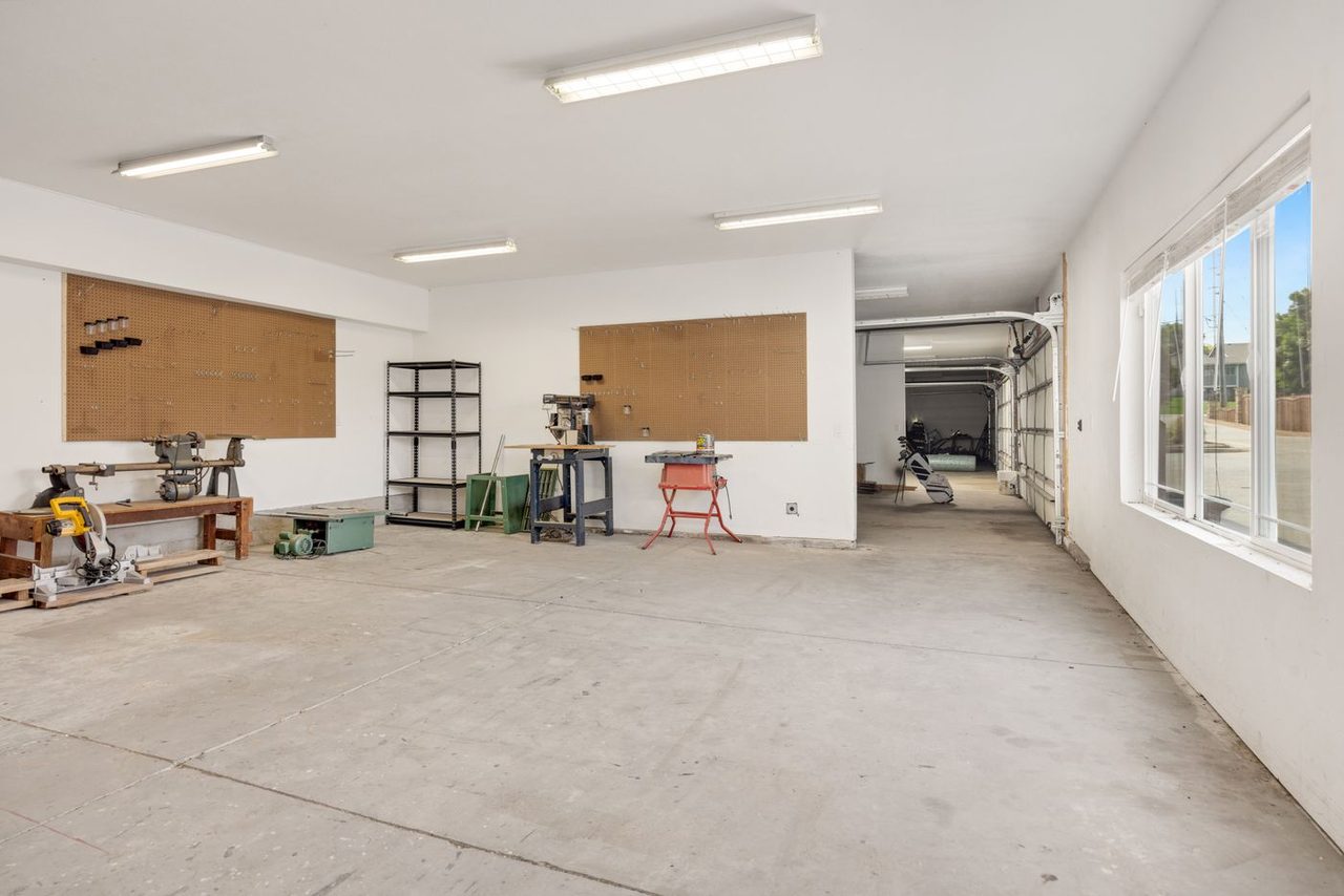 Workshop with worn and stained bare concrete floor