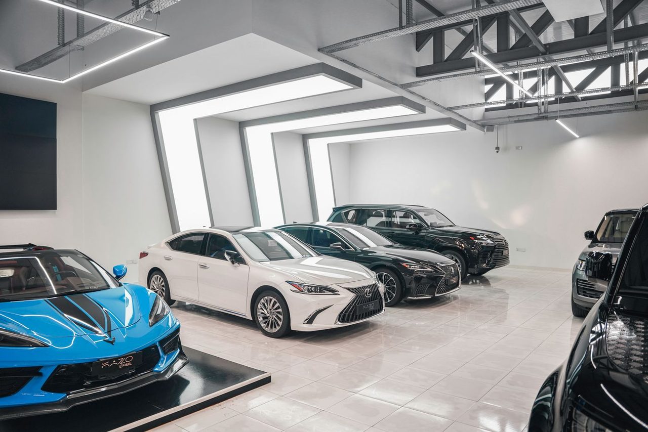 Car showroom with a high-gloss coated floor reflecting the vehicles on display