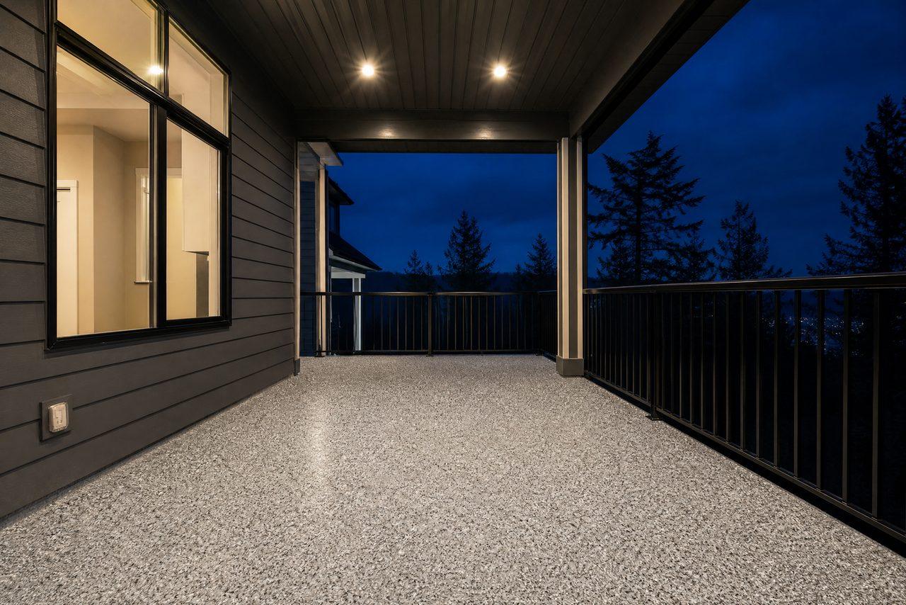 Covered back porch at dusk with a gray and white flake epoxy floor